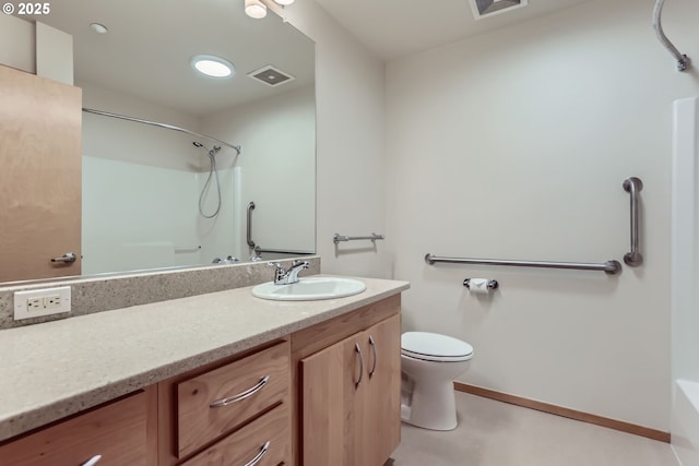 bathroom featuring visible vents, vanity, baseboards, and walk in shower