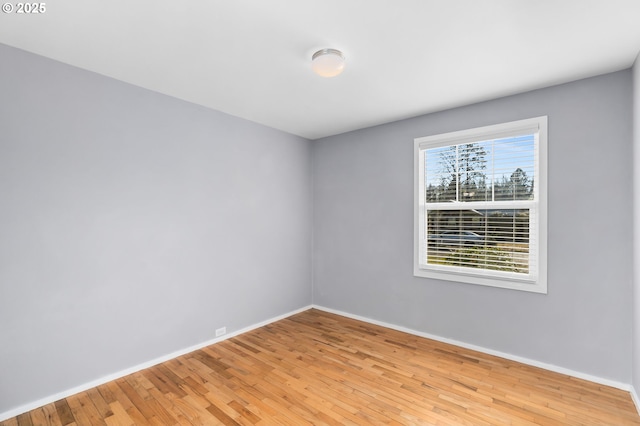 spare room with light hardwood / wood-style floors