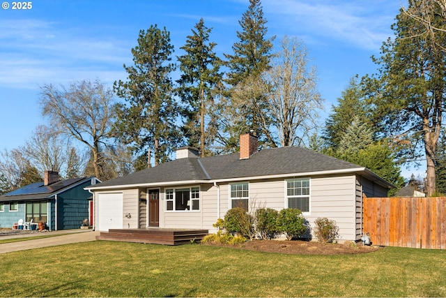 ranch-style home featuring a garage and a front yard