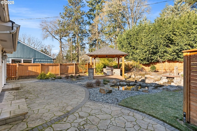 view of patio with a gazebo and exterior kitchen