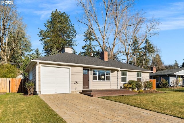 single story home featuring a garage and a front yard