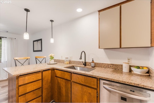 7148 SW Murray Blvd, Beaverton, OR 97008 - kitchen with dishwasher, a sink, a peninsula, decorative light fixtures, and light stone counters