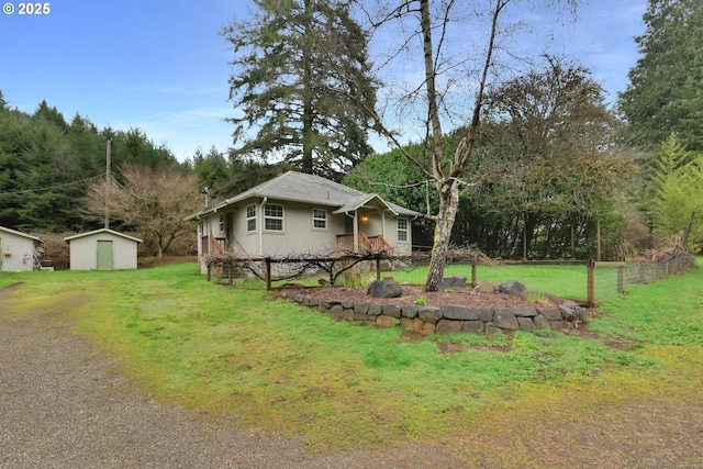 12813 Village Rd Unit 12, Swisshome, OR 97480 - view of side of property featuring a storage shed, a lawn, and an outdoor structure