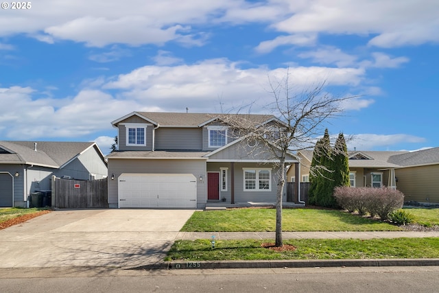 traditional home featuring covered porch, an attached garage, fence, driveway, and a front lawn