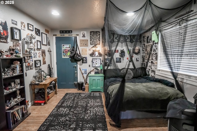 bedroom with light wood finished floors