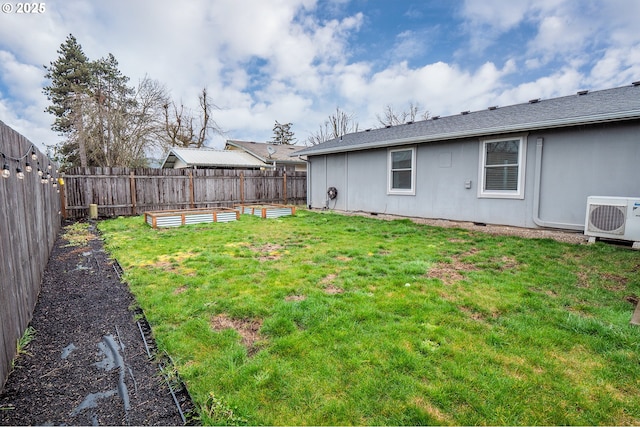 view of yard with ac unit, a fenced backyard, and a garden