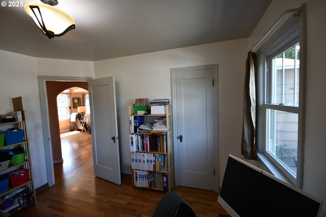 719 W 11th St, The Dalles, OR 97058 - interior space with plenty of natural light, wood finished floors, baseboards, and arched walkways