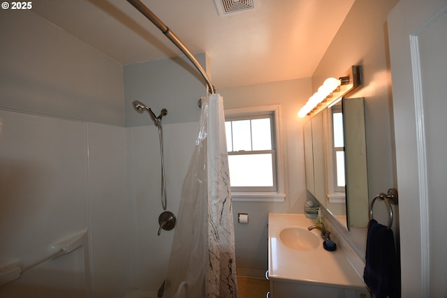 719 W 11th St, The Dalles, OR 97058 - bathroom featuring vanity, visible vents, and curtained shower