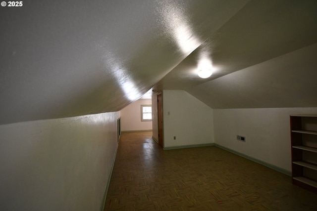 719 W 11th St, The Dalles, OR 97058 - additional living space featuring baseboards, visible vents, and vaulted ceiling