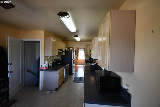 719 W 11th St, The Dalles, OR 97058 - kitchen featuring under cabinet range hood, gas stove, visible vents, black microwave, and dark countertops