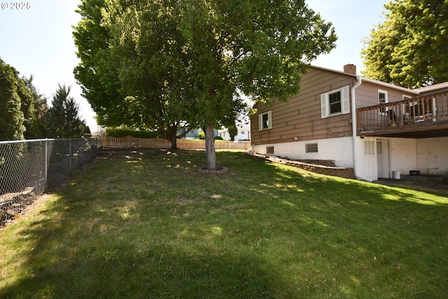 719 W 11th St, The Dalles, OR 97058 - view of yard with a wooden deck and a fenced backyard