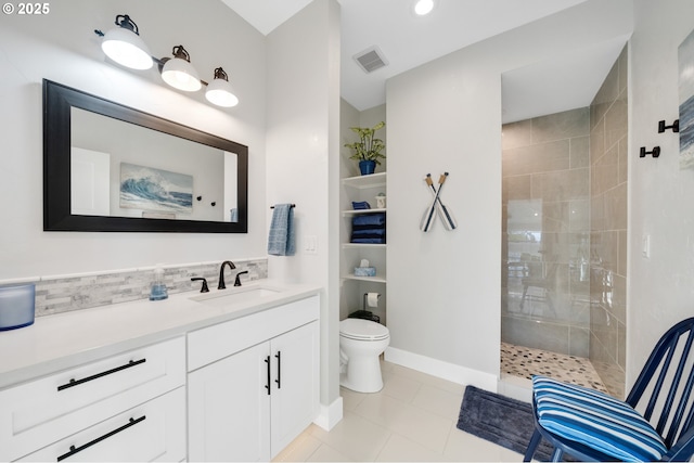bathroom with visible vents, walk in shower, vanity, tile patterned floors, and toilet