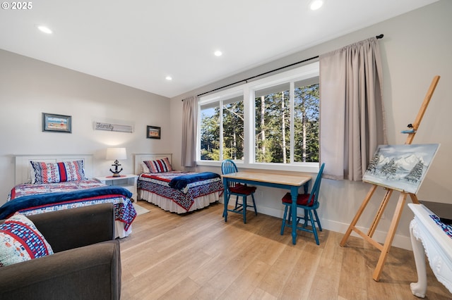 bedroom with recessed lighting, baseboards, and wood finished floors