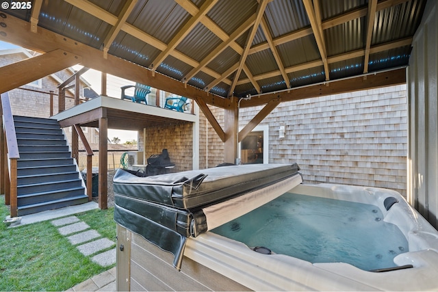 wooden deck featuring a gazebo and stairway
