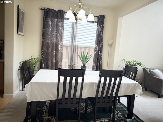 20053 SW 54th Ter, Tualatin, OR 97062 - dining room with a chandelier, baseboards, and wood finished floors