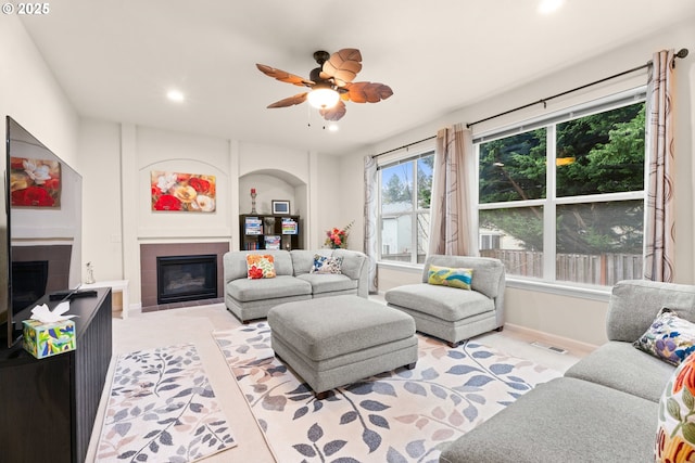 20053 SW 54th Ter, Tualatin, OR 97062 - living area with a glass covered fireplace, ceiling fan, recessed lighting, and baseboards