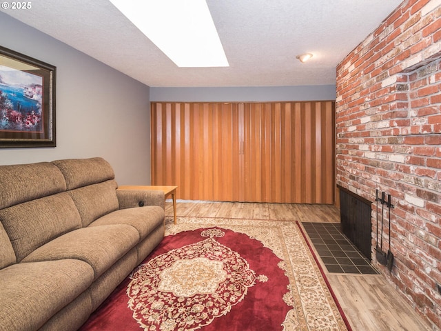 19838 NE Wasco St, Portland, OR 97230 - living room with wood finished floors, a textured ceiling, and a skylight