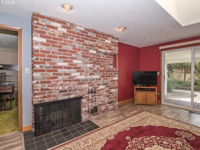 19838 NE Wasco St, Portland, OR 97230 - living room with wood finished floors, a textured ceiling, and a fireplace