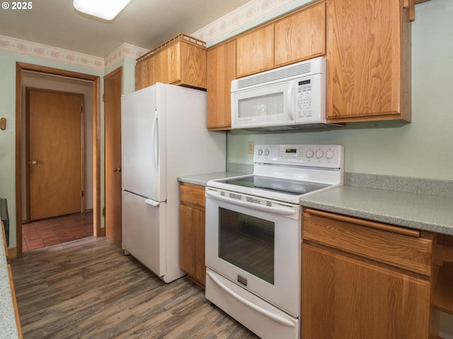 19838 NE Wasco St, Portland, OR 97230 - kitchen featuring white appliances, wood finished floors, light countertops, and brown cabinetry