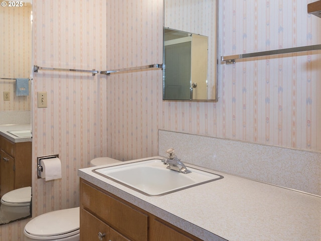 19838 NE Wasco St, Portland, OR 97230 - bathroom with wallpapered walls and vanity