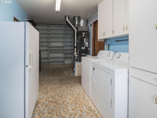 19838 NE Wasco St, Portland, OR 97230 - laundry area with cabinet space, washer and clothes dryer, and heating unit