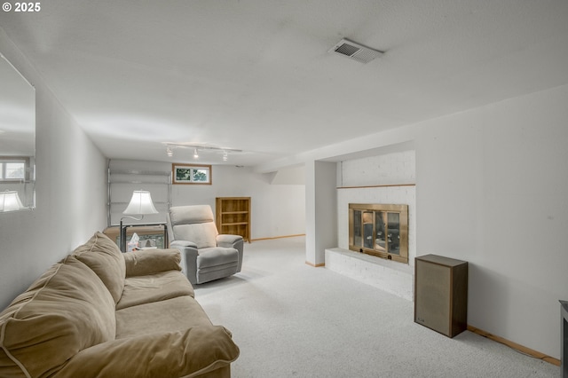 living room with light colored carpet and a fireplace