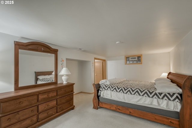 bedroom with light colored carpet