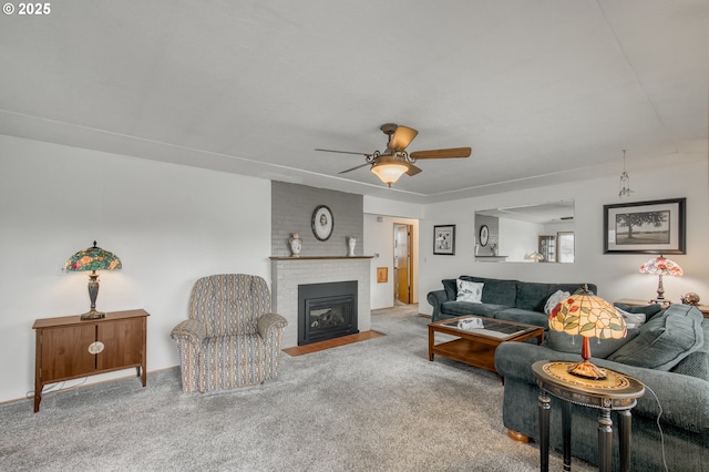 living room featuring ceiling fan, a fireplace, and carpet floors