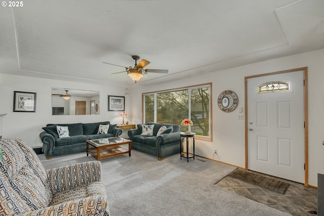 living room featuring ceiling fan and carpet