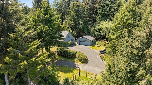 birds eye view of property with a forest view