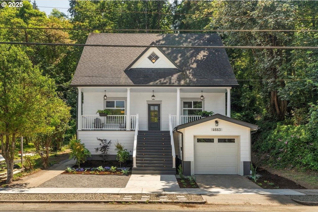 view of front of home featuring a garage and a porch