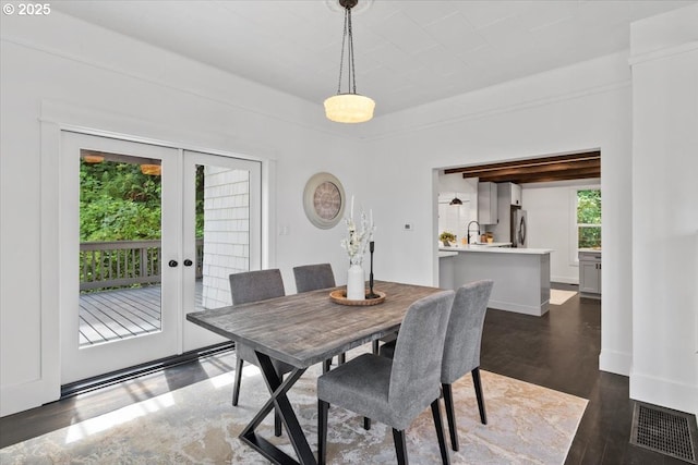 dining room featuring dark hardwood / wood-style floors and french doors