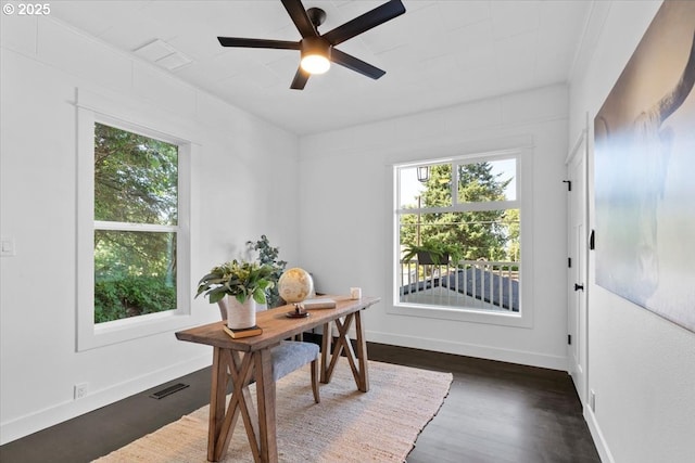 home office featuring ceiling fan and dark wood-type flooring