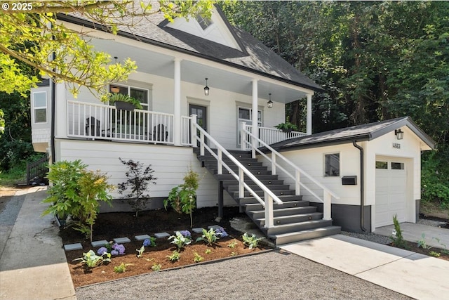 view of front of property featuring a porch and a garage