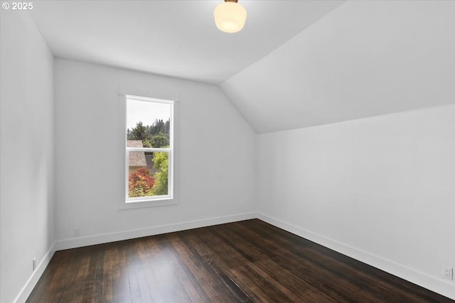 bonus room with lofted ceiling and hardwood / wood-style floors