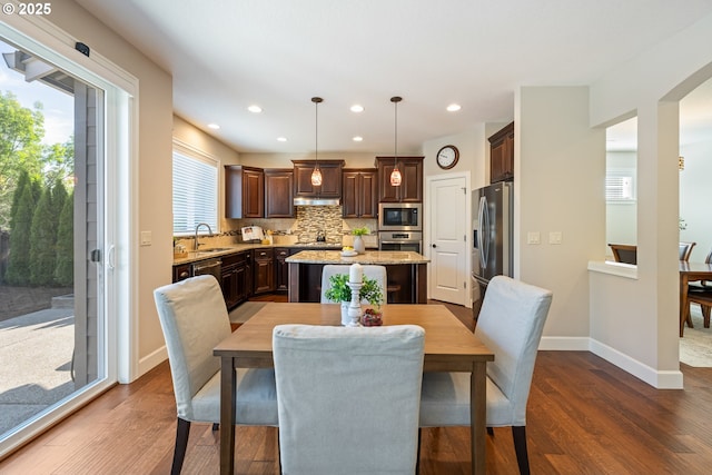17007 NW Reuben Ln, Portland, OR 97229 - dining space featuring dark wood finished floors and recessed lighting