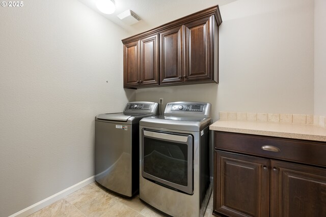 17007 NW Reuben Ln, Portland, OR 97229 - laundry area with washer and dryer and cabinet space