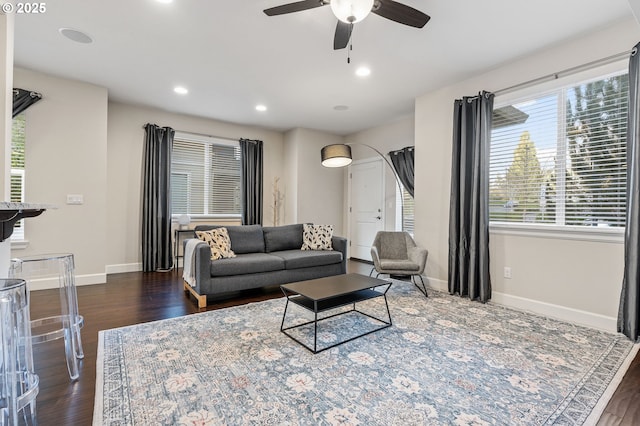 living room featuring dark wood-style floors, ceiling fan, baseboards, and recessed lighting