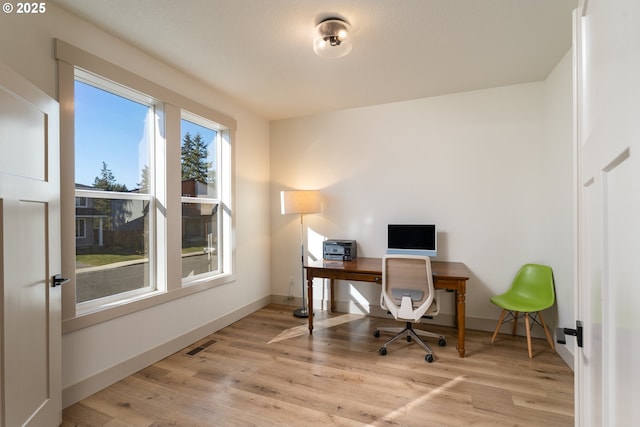 office area with light hardwood / wood-style flooring