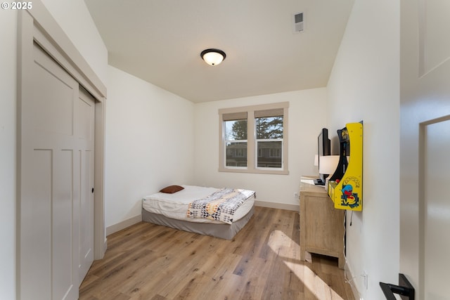 bedroom with light hardwood / wood-style floors