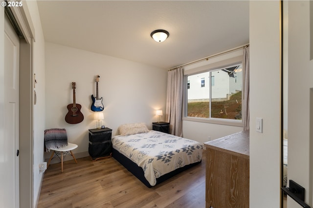 bedroom with hardwood / wood-style floors