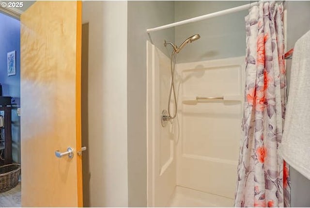 bathroom with a shower with curtain