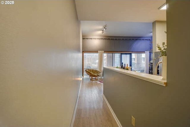 hallway with light wood-type flooring