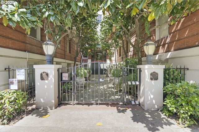 view of gate with fence