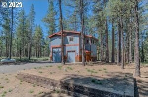 view of poultry coop featuring a garage