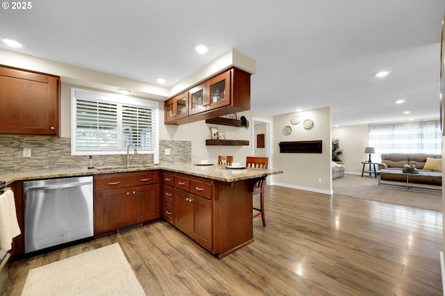 1808 S 4th St, Cottage Grove, OR 97424 - kitchen with dishwasher, a sink, a kitchen breakfast bar, open floor plan, and light wood finished floors