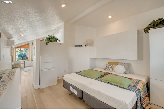 bedroom featuring vaulted ceiling, recessed lighting, a textured ceiling, and light wood-style floors