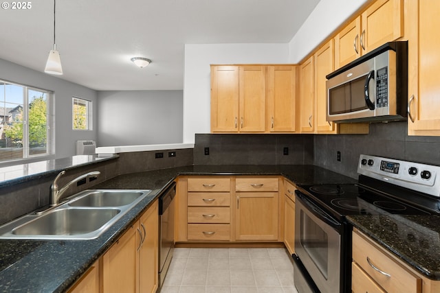 645 NW Falling Waters Ln Unit 303, Portland, OR 97229 - kitchen with stainless steel appliances, light brown cabinetry, a sink, and backsplash