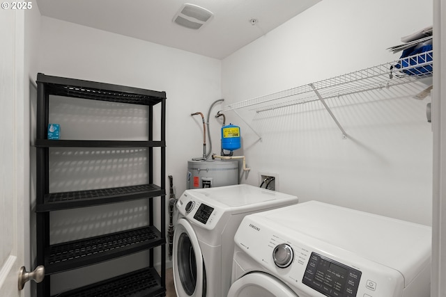 645 NW Falling Waters Ln Unit 303, Portland, OR 97229 - washroom with secured water heater, visible vents, laundry area, and washer and clothes dryer