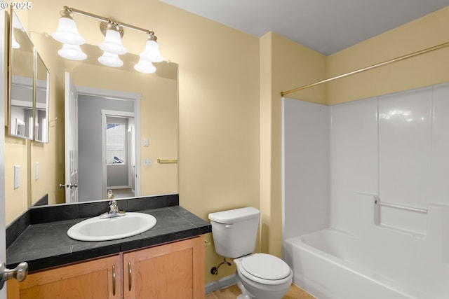645 NW Falling Waters Ln Unit 303, Portland, OR 97229 - bathroom featuring toilet, vanity, and shower / tub combination